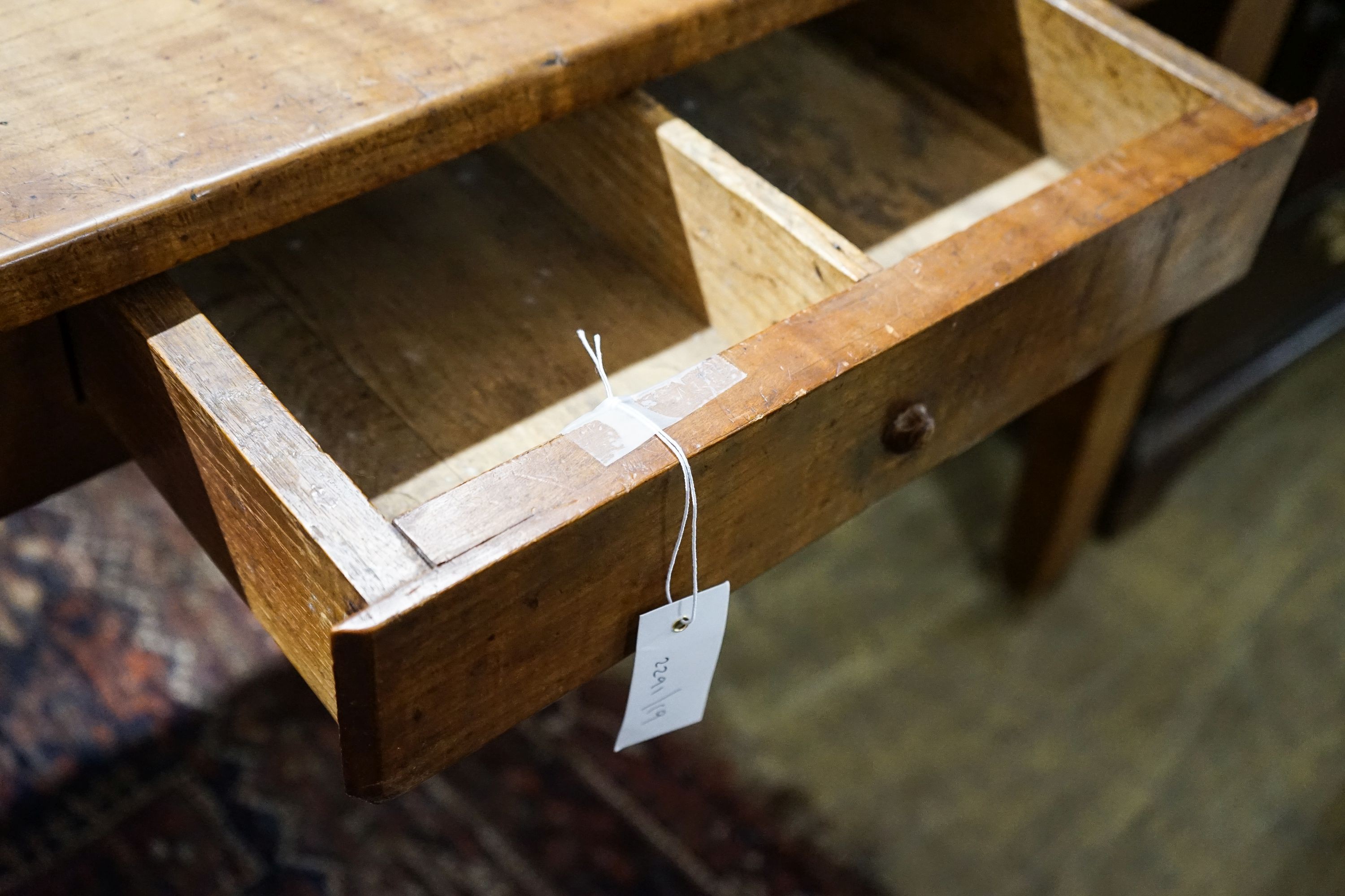 A 19th century French fruitwood and cherry farmhouse side table, width 130cm, depth 69cm, height 76cm